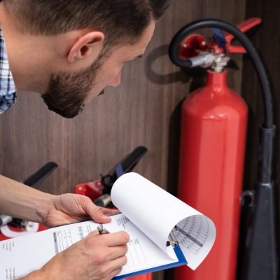 Checking Fire Extinguisher. Safety Checking Fire Extinguisher. Safety